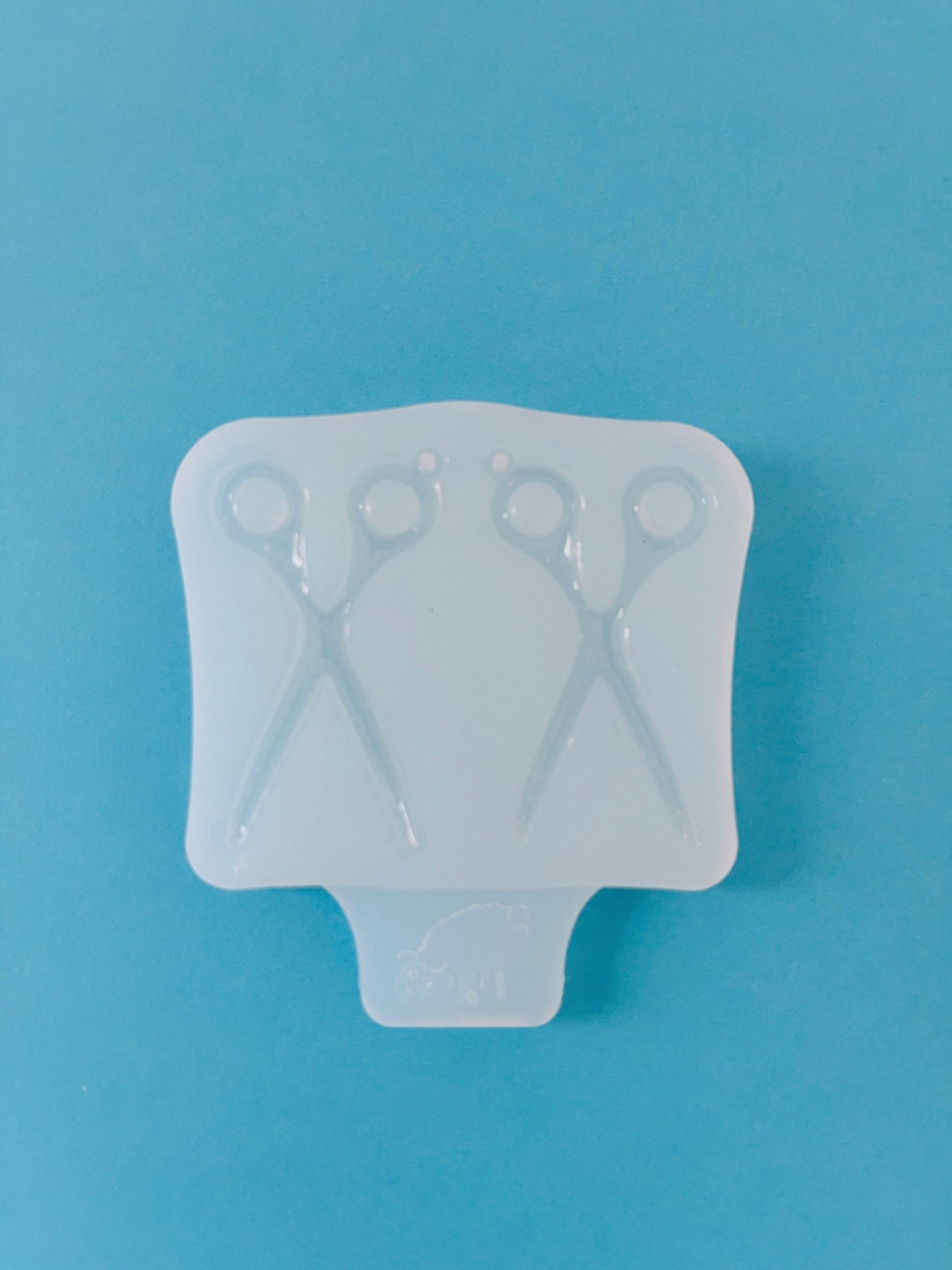 Silicone mold for earrings in the form of scissors. Mold for epoxy and UV resin. Glossy resin form. Rubber mold