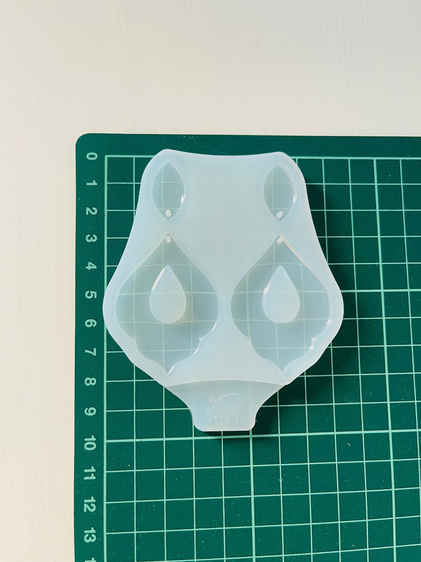 Silicone mold for making epoxy resin earrings.