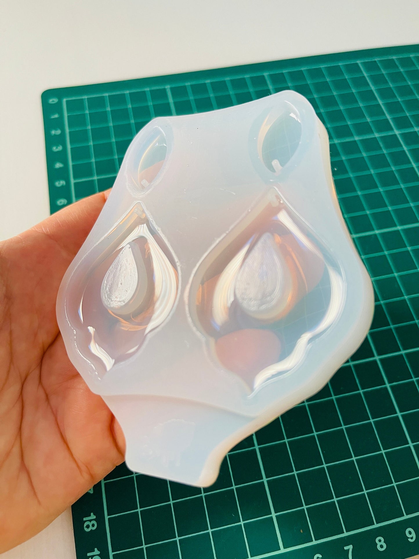 Silicone mold for making epoxy resin earrings.
