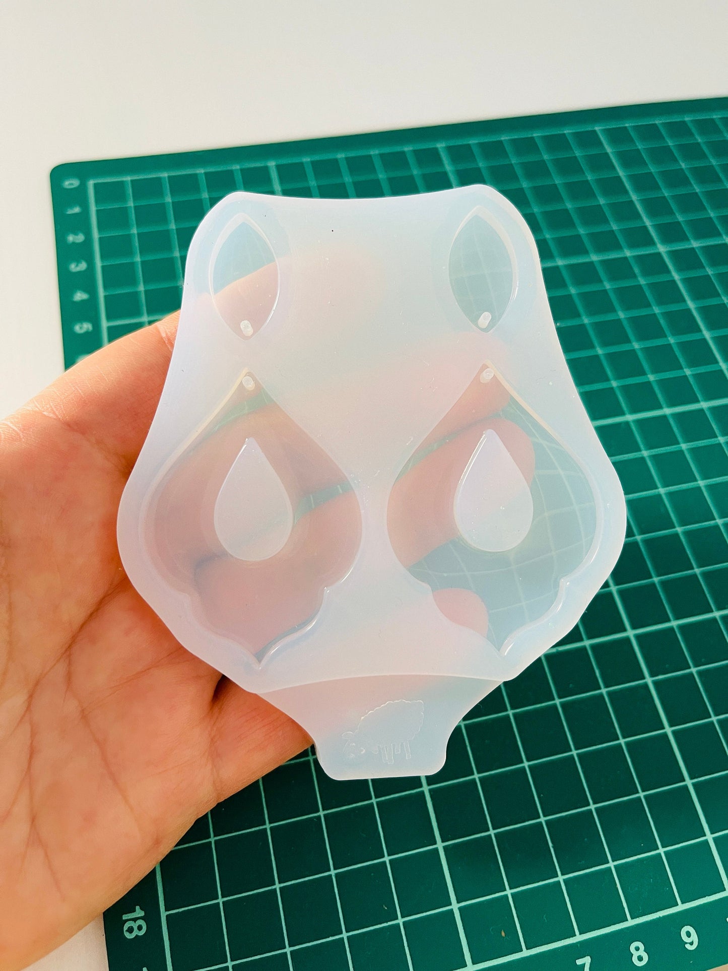 Silicone mold for making epoxy resin earrings.