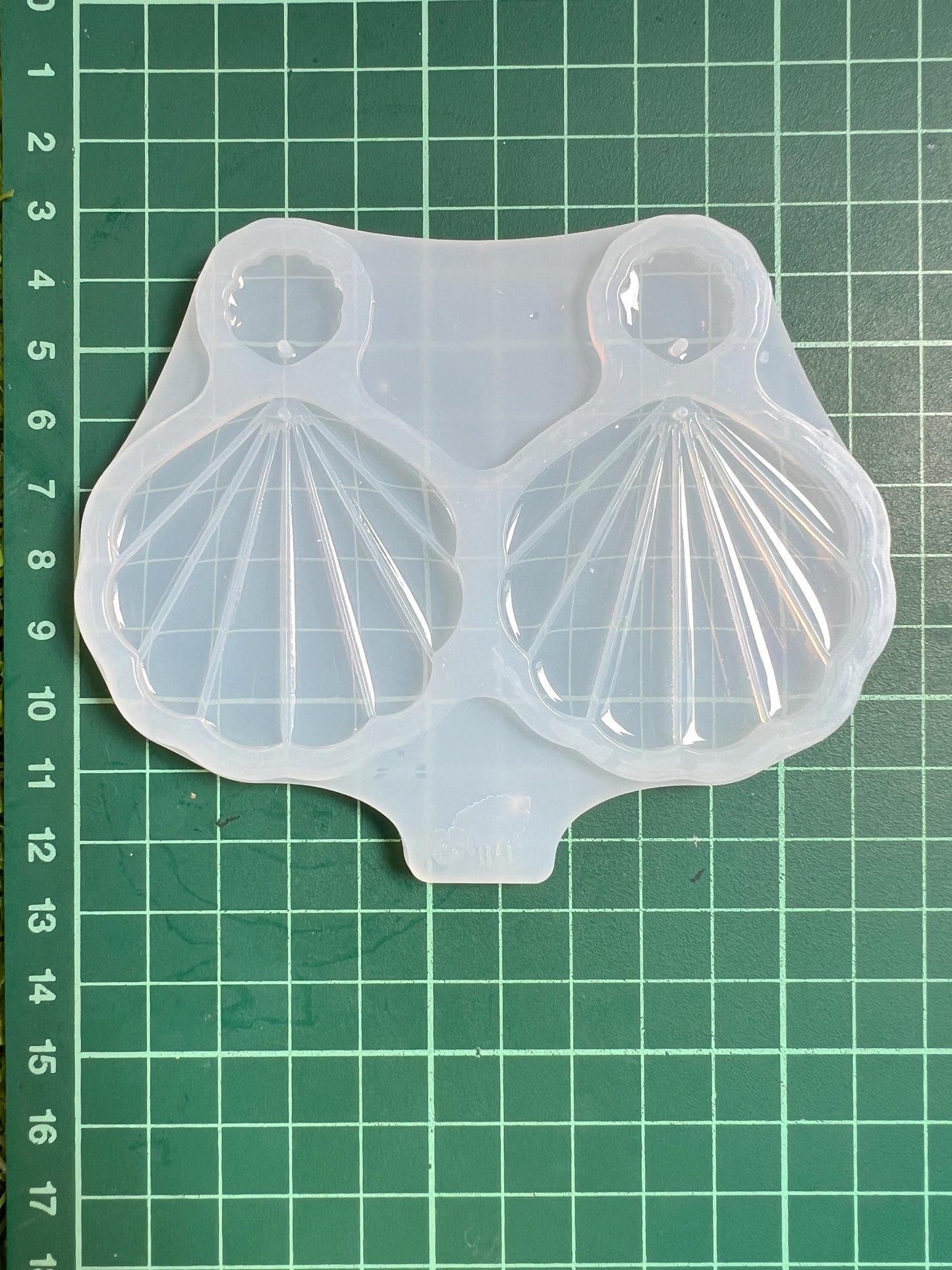 Seashell. Silicone mold for making earrings from epoxy resin.